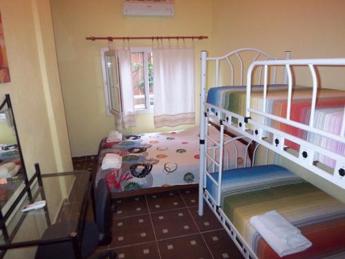 Postel nebo postele na pokoji v ubytování izmir Tatil Evi Beach Resort Seferihisar