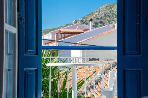 an open window with a view of a building at Hotel Mariona in Pythagoreio