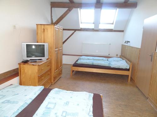 Postel nebo postele na pokoji v ubytování U Nás - Apartmán Zajíc