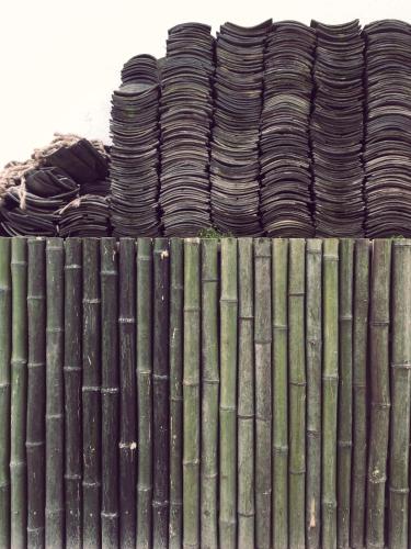 a stack of piled hats on top of a fence at Wally House青山惠风民宿 in Zhangjiajie