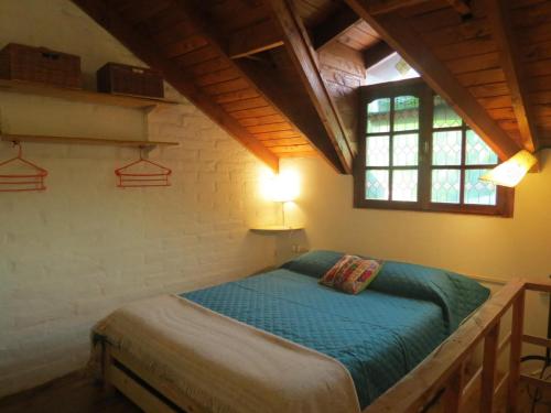 A bed or beds in a room at La Casa De La Abuela Departamentos