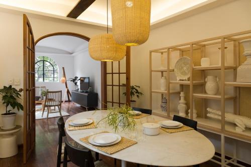 a dining room with a table and chairs at Casa Dovela in Mexico City