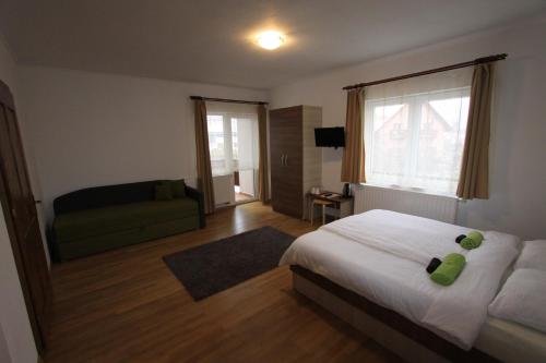 A bed or beds in a room at Boncz Udvar