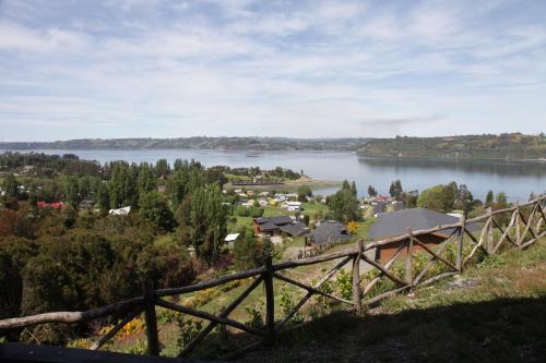 a view of a lake from a hill at Turismo del Bosque in Castro