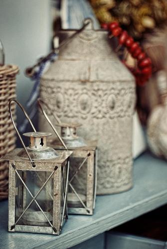 three metal lanterns sitting on a shelf at BB Boutique Hotel in Újlengyel