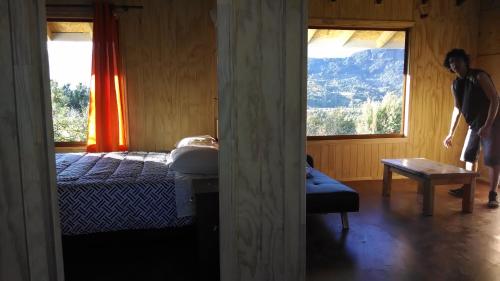 En eller flere senge i et værelse på Cabañas Lomas del Salto
