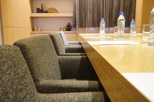 a long table with two bottles of water on it at Beacon Hotel in Taichung