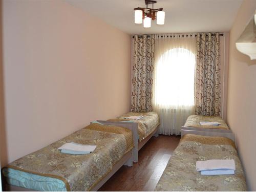 Katil atau katil-katil dalam bilik di Flamingo Hotel
