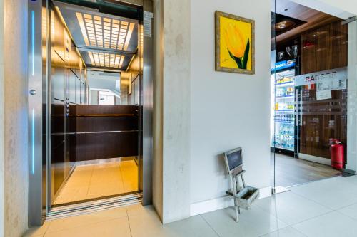 an entrance to a store with a glass door at Radsor Hotel in Râşnov