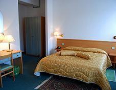 Postel nebo postele na pokoji v ubytování Hotel Etruria