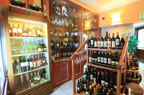 a bar with a lot of bottles of wine at Balconata 2.0 Banqueting & Accommodations in Lucera