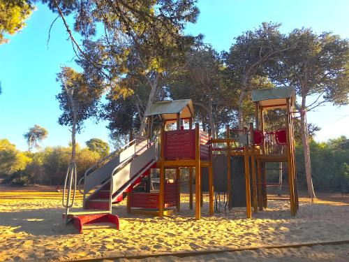 a playground with a slide in a park at Maison de Vacances Harhoura in El Harhoura