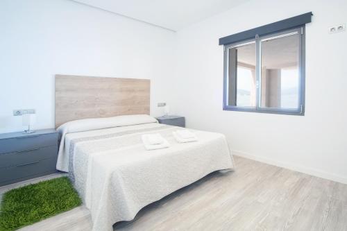 Posteľ alebo postele v izbe v ubytovaní Aixa