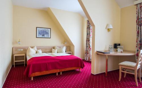 Postel nebo postele na pokoji v ubytování Hotel Acht Linden