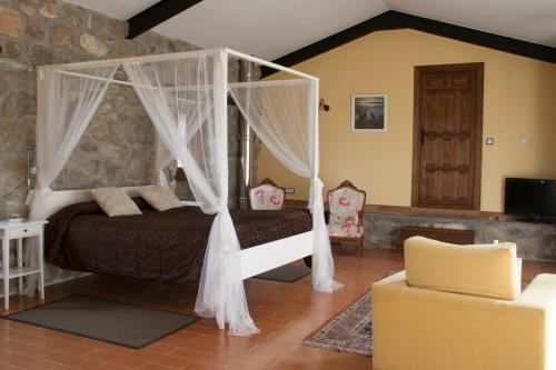 Postel nebo postele na pokoji v ubytování Posada Palacio Manjabalago