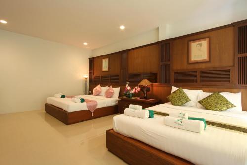 Postel nebo postele na pokoji v ubytování The Green Beach Resort