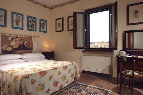 Кровать или кровати в номере Locanda La Pieve