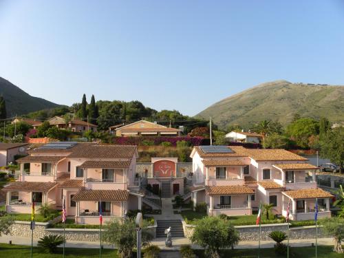 a row of houses with mountains in the background at Hotel Ristorante Borgo La Tana in Maratea