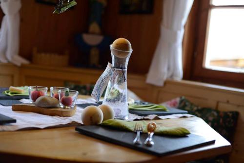 a table with an egg and vegetables on a table at Biobauernhof Gehrnerhof am Arlberg in Warth am Arlberg