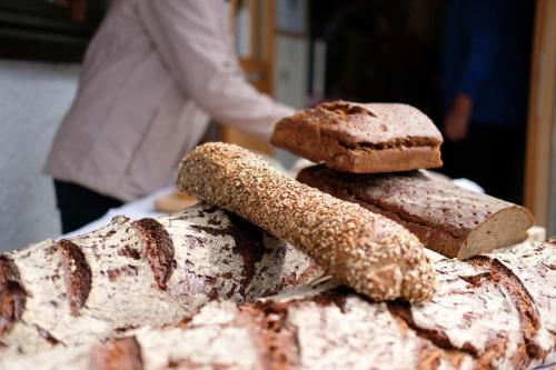 a pile of bread sitting on top of a table at Biobauernhof Gehrnerhof am Arlberg in Warth am Arlberg