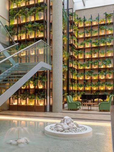 a building with a staircase with plants on it at H10 Marina Barcelona in Barcelona