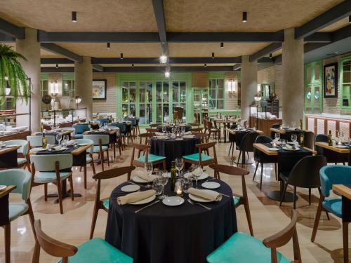 a dining room with tables and chairs at H10 Marina Barcelona in Barcelona