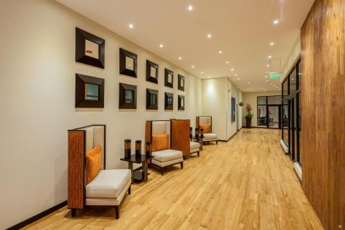 a corridor of a salon with a waiting room at Wyndham Quito Airport in Tababela