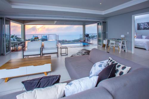 a living room with a couch and a table at 1 Ezulweni in Ballito