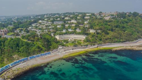 an aerial view of a city and the ocean at The Osborne Apartments in Torquay