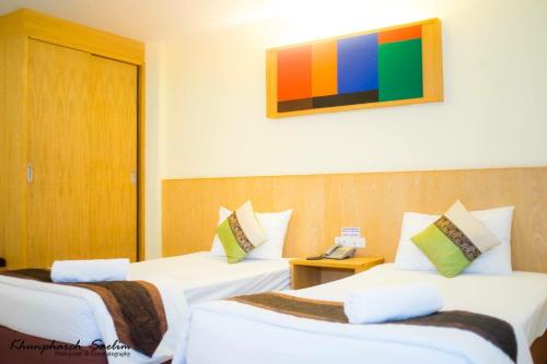 Ένα ή περισσότερα κρεβάτια σε δωμάτιο στο The Lephant Hotel