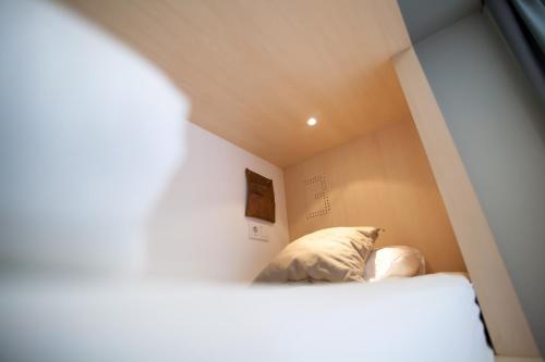 Ένα ή περισσότερα κρεβάτια σε δωμάτιο στο Toc Hostel Madrid