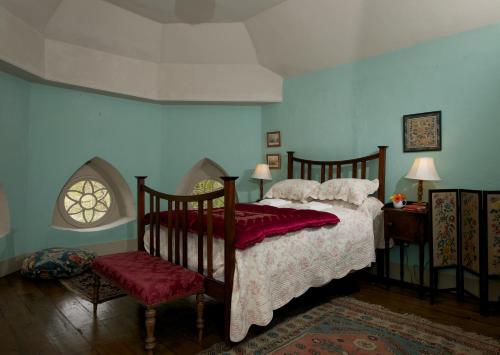 En eller flere senge i et værelse på Batty Langley Lodge