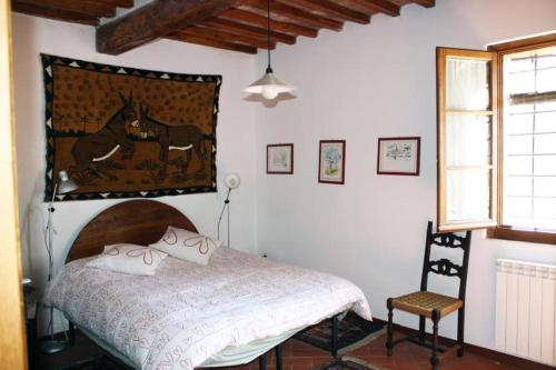 Säng eller sängar i ett rum på Agriturismo capanna delle Cozzole