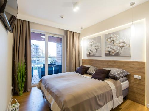 Postel nebo postele na pokoji v ubytování Apartament A106 Polanki Park SPA