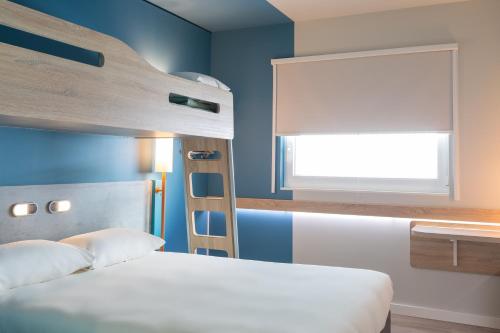 Un ou plusieurs lits dans un hébergement de l'établissement ibis budget Geneve Palexpo Aeroport