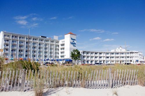 a large white building in front of a beach at Marquis De Lafayette in Cape May