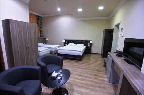  Yerevan Deluxe Hotel -  Room  picture :   Tea/Coffee maker    Shower    Safety deposit box                           