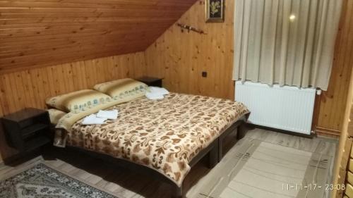 Ein Bett oder Betten in einem Zimmer der Unterkunft Apartman Tošić