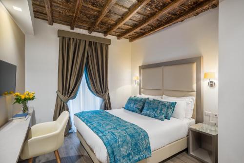 A bed or beds in a room at Reginella Suites