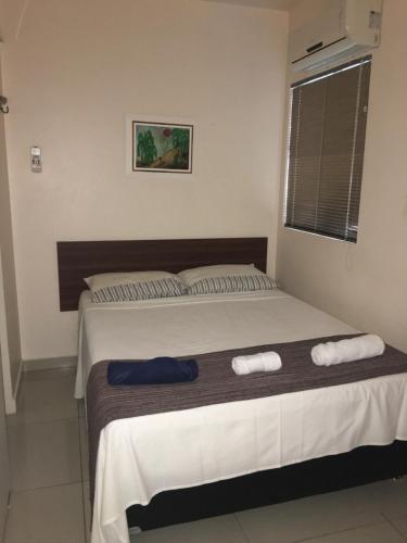 Ένα ή περισσότερα κρεβάτια σε δωμάτιο στο Férias na praia de Ponta Verde