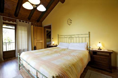 En eller flere senge i et værelse på Rustico La Vigna