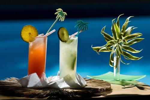 two cocktails sitting on top of a table at Vilangelim Eco-Pousada in Imbassai