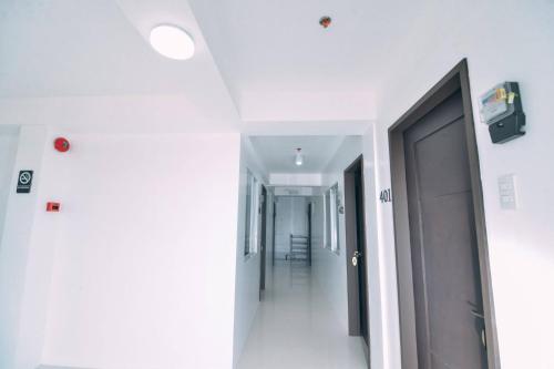 a hallway of a hospital with a door at The Strand Suites and Dormitel in Davao City