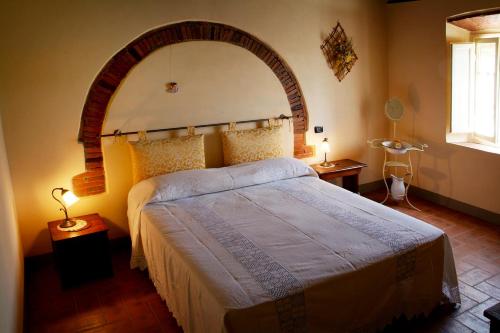 Postel nebo postele na pokoji v ubytování La Chiusa di Nanni