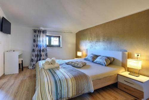 Ένα ή περισσότερα κρεβάτια σε δωμάτιο στο Villa Casa Ivano