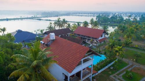 an aerial view of a house with a red roof at Indriya Sands in Cherai Beach