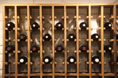 a wall of wine bottles in a wine cellar at Shota @ Rustaveli Boutique Hotel in Tbilisi City