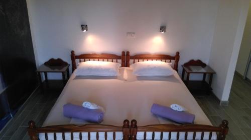 a bedroom with a large bed with two pillows at Guest House Marija in Sumartin