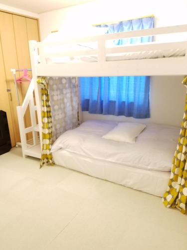 Postel nebo postele na pokoji v ubytování Villa M Guesthouse