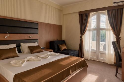 Postel nebo postele na pokoji v ubytování Hotel Crnogorska Kuća